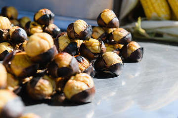 Roasted chestnuts at street food market outdoors