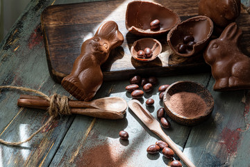 dark chocolate of different shapes on rustic wood to eat at special parties