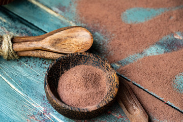 dark chocolate of different shapes on rustic wood to eat at special parties