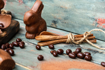 dark chocolate of different shapes on rustic wood to eat at special parties