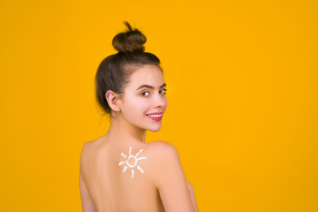 Summer and sun concept. Skin care in summer time. SPF. Vacation and rest. Happy woman with sun on...