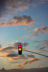 Red traffic light: traffic on the road, urban life