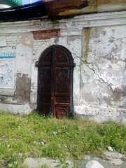 Fototapeta premium Ancient doors the old fortress near the temple.
