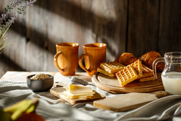 Breakfast on the table in the light of the morning sun