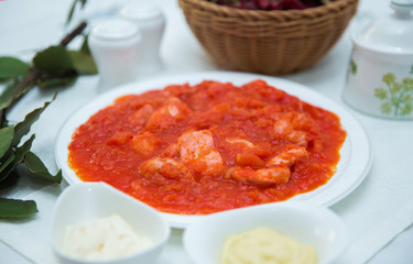 Tomato Pickle . Chicken and tomatoes . Red Dry Pepper in Traditional Basket . Tomato Pickle . Chakhokhbili - chicken stewed with tomatoes and onions. salt, pepper. Red Dry Pepper in Basket .