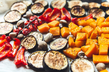 Simple Healthy Detox Dinner from different vegetables such as aubergine, red pepper, cherry tomatoes, Butternut squash