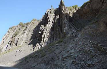 Mountainous road leading to Lahic village in Ismayilli region of Azerbaijan, with car.
