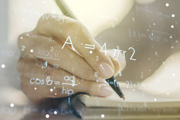 Creative scientific formula illustration with woman hand writing in diary on background, science...