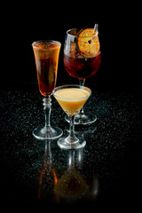 alcoholic cocktails on a black background