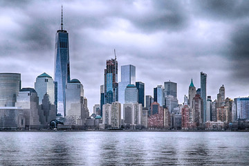 Fototapeta premium View of Manhattan Skyline, from Liberty State Park in Jersey City, New Jersey. Manhattan is the most densely populated of the five boroughs of New York City.