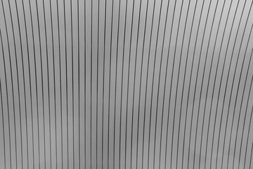 Fototapeta premium Striped black and white background image. Сeiling fragment made with rack panels. Soft focus.