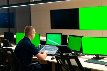 Male operator watching the cctv monitors