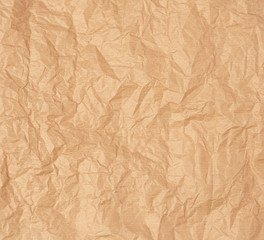 crumpled brown sheet of parchment paper