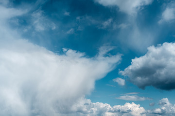 Dramatic sky with stormy clouds. The combination of light and dark clouds. Color trends.