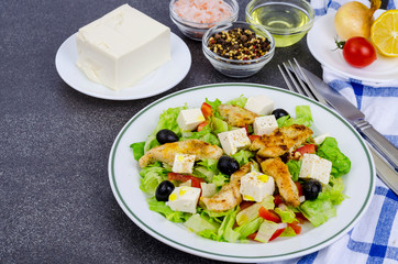 Vegetable salad with tofu and chicken breast.