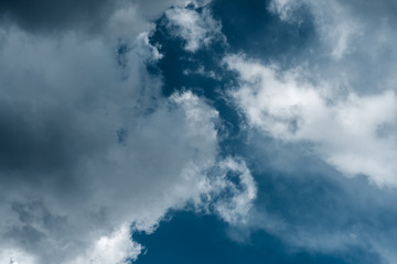 Dramatic sky with stormy clouds. The combination of light and dark clouds. Color trends.