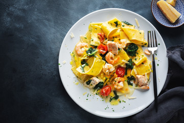 Pasty with shrimps and vegetables on plate