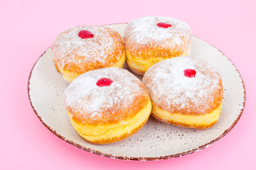 Traditional food doughnuts with icing sugar and jam. Concept and background Jewish holiday Hanukkah.