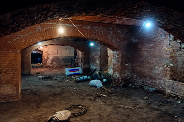 Abandoned empty old dark underground vaulted cellar