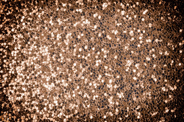 Festive shiny background for sites, layouts and cards. Dark golden sparkles close-up.