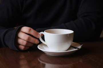 man holding a cup