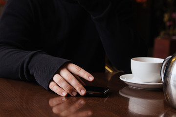 man with cup of coffee and laptop