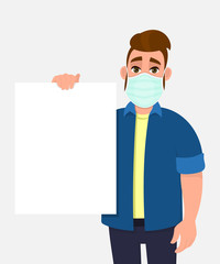 Hipster young man wearing medical mask and holding blank poster. Trendy person covering face protection from virus. Male character showing white banner. Cartoon illustration design in vector style.