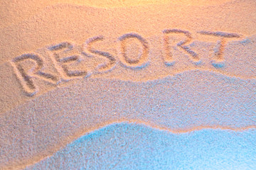 RESORT lettering on sand with wave and neon light. Minimal exotic vacation and travel concept, Flat lay top view copy space