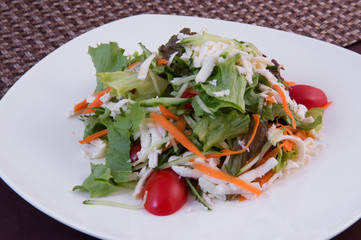 Vegetable salad with cheese. Fresh tomatoes, cucumbers, carrots, lettuce
