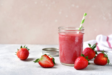 Fresh delicious strawberry banana smoothie in a mason jar.