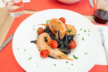 Italian pasta nera with prawns