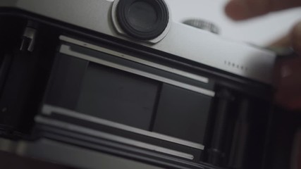 Checking old vintage camera - takes photos / release shutter - open and closed