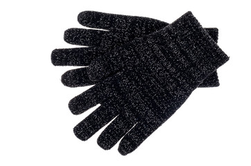 Black knitted baby gloves isolated on white background