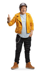 Full length portrait of a mature biker in a yellow leather jacket showing thumb up