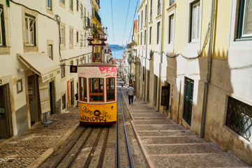 Naklejka na ściany i meble Yellow tram in Lisbon, Portugal