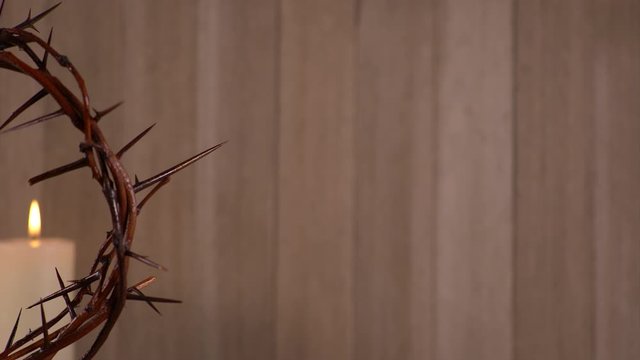 Crown of Thorns with Candle in the Background	