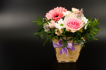 Flowers, bouquet in stylish wooden box. Studio Photo