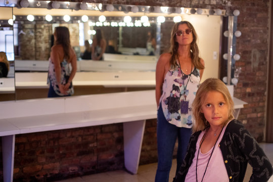 Young girl and woman backstage in dressing room