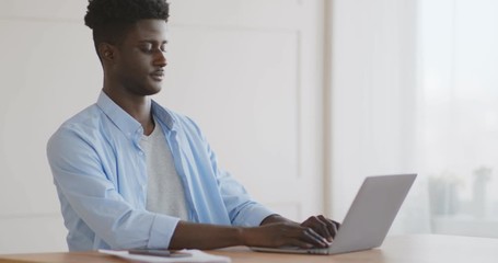 Thoughtful african american guy thinking new anticrisis plan