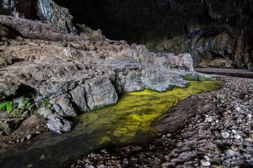 Interior of the Terra ronca cave, the main of the terra ronca caves complex, Goias, Brazil. The yellow portion of water means high sulfur concentration.