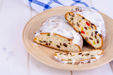 Traditional Christmas stollen with nuts and candied fruits.