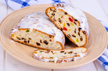 Traditional Christmas stollen with nuts and candied fruits.