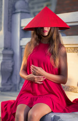 Obraz na płótnie Canvas Fashion portrait of a beautiful woman in red hat