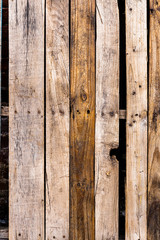 Verticle Textured Wooden plank background with rusty nails and knots throughout