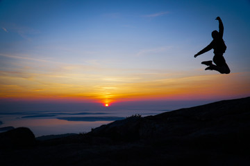 silhouette of jumping man