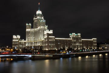 Fototapeta na wymiar Night view of the Moscow river and high-rise on Kotelnicheskaya Embankment, Russia, Moscow