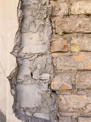 Fragment of an old brick wall. Background, brick texture