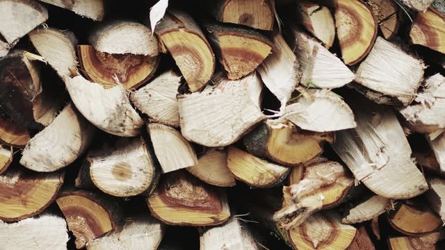 Stop motion video storage of firewood. Firewood stacked in intended. 4K