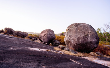 Fototapeta na wymiar Various boulders scattered on the granite rock outcrop at Boulder Rock, Karragullen, Western Australia