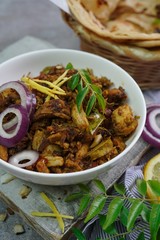 Lachha Paratha or Indian layered Roti with Pork Fry, selective focus